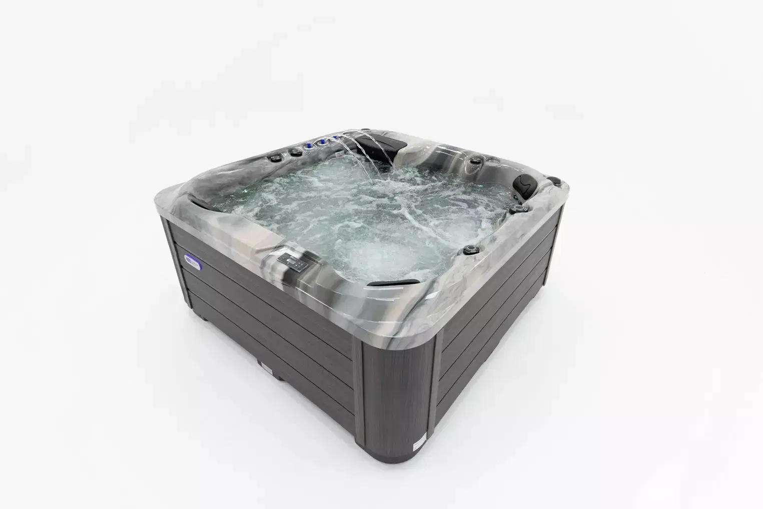 Dark gray hot tub with bubbling water and multiple jets, control panel visible on the side.